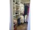 Organized walk-in closet featuring built-in shelving and ample storage at 10558 E Meadowhill Dr, Scottsdale, AZ 85255