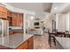 Kitchen with stainless steel appliances and views of the living room at 10558 E Meadowhill Dr, Scottsdale, AZ 85255