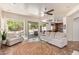 Bright living room open to the backyard and a view of the kitchen at 10558 E Meadowhill Dr, Scottsdale, AZ 85255