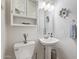 Powder room featuring updated sink, fixtures, and decor at 10558 E Meadowhill Dr, Scottsdale, AZ 85255