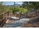 Community walking path with railings amid desert landscape, perfect for exercise at 10558 E Meadowhill Dr, Scottsdale, AZ 85255