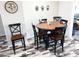 Charming dining room with wood table and chairs set on wood-look flooring at 1132 S 81St Pl, Mesa, AZ 85208