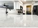 Close-up view of a modern kitchen with white quartz countertops and stainless steel appliances at 1132 S 81St Pl, Mesa, AZ 85208