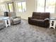 Bright living room with comfortable seating, perfect for relaxation and socializing at 1132 S 81St Pl, Mesa, AZ 85208