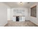 View of a built in bar area with mini fridge and cabinets at 12603 W Blackstone Ln, Peoria, AZ 85383