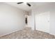 Bedroom featuring a ceiling fan, neutral walls, and a closet with sliding doors at 12603 W Blackstone Ln, Peoria, AZ 85383