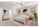 Relaxing bedroom with a wooden bed frame, plush bedding, and stylish decor at 12603 W Blackstone Ln, Peoria, AZ 85383