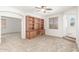 Bonus room with custom built-in cabinets, neutral walls, and an open doorway at 12603 W Blackstone Ln, Peoria, AZ 85383