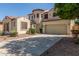 Two story stucco house with a terracotta roof and a two car garage at 12603 W Blackstone Ln, Peoria, AZ 85383