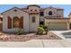 Two story stucco house with a terracotta roof and a two car garage at 12603 W Blackstone Ln, Peoria, AZ 85383