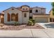 Two story stucco house with a terracotta roof and a two car garage at 12603 W Blackstone Ln, Peoria, AZ 85383