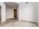 View of the foyer area featuring tile and carpet flooring at 12603 W Blackstone Ln, Peoria, AZ 85383