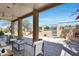 Covered patio with lounge seating area, perfect for enjoying the outdoor view at 1334 E Voltaire Ave, Phoenix, AZ 85022