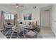 Cozy living room featuring stylish furniture, a modern rug, and natural light from the balcony at 14950 W Mountain View Blvd # 5107, Surprise, AZ 85374