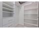 Spacious walk-in closet with shelving and drawers for organized storage at 14950 W Mountain View Blvd # 5107, Surprise, AZ 85374