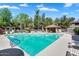 Community pool featuring lounge chairs, shaded areas, and lush landscaping, creating a resort-like atmosphere at 15252 N 100Th St # 2141, Scottsdale, AZ 85260