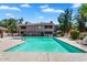 Outdoor pool area with lounge chairs, lush landscaping, and a clear blue sky on a sunny day at 15252 N 100Th St # 2141, Scottsdale, AZ 85260