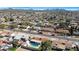 High-angle view of a residential neighborhood featuring well-kept houses with private swimming pools and mature trees at 1604 W Kerry Ln, Phoenix, AZ 85027