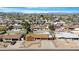 An aerial view of the neighborhood shows single-Gathering homes and clear, blue skies at 1604 W Kerry Ln, Phoenix, AZ 85027