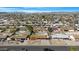 An aerial view of the neighborhood shows single-Gathering homes and clear, blue skies at 1604 W Kerry Ln, Phoenix, AZ 85027