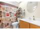 Bathroom featuring a vanity, toilet, and shower with decorative shower curtain at 1604 W Kerry Ln, Phoenix, AZ 85027