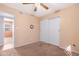 This bedroom features neutral carpet, closet, and ceiling fan at 1604 W Kerry Ln, Phoenix, AZ 85027