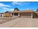 Charming single-story home featuring a two-car garage and low-maintenance landscaping at 1604 W Kerry Ln, Phoenix, AZ 85027