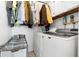 Functional laundry room with washer, dryer, and storage cabinets at 1604 W Kerry Ln, Phoenix, AZ 85027