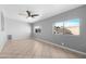 Bright living room featuring neutral paint, tile floors, and multiple windows at 1604 W Kerry Ln, Phoenix, AZ 85027