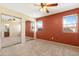 Carpeted main bedroom featuring mirrored closet doors and natural light at 1604 W Kerry Ln, Phoenix, AZ 85027