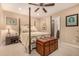 Cozy bedroom featuring a four-poster bed, neutral tones and carpet, and access to the bathroom at 16657 E Gunsight Dr # 181, Fountain Hills, AZ 85268