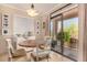 Bright dining area featuring a wooden table, and patio access with natural light at 16657 E Gunsight Dr # 181, Fountain Hills, AZ 85268