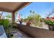 Inviting covered patio area with vibrant flowers and a scenic view, ideal for enjoying the outdoors at 16657 E Gunsight Dr # 181, Fountain Hills, AZ 85268