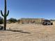 New home construction wood frame, truck and supplies on large lot with desert landscape at 1800 W Caramel Ct, Queen Creek, AZ 85144