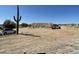 New home under construction with frame, truck and workers on a sunny day at 1800 W Caramel Ct, Queen Creek, AZ 85144