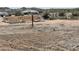 Wood frame of a new home under construction on a large desert lot at 1800 W Caramel Ct, Queen Creek, AZ 85144