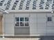 Under construction home with visible exterior and wrapped windows in a desert landscape at 1800 W Caramel Ct, Queen Creek, AZ 85144