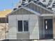 Under construction home with visible exterior and wrapped window in a desert landscape at 1800 W Caramel Ct, Queen Creek, AZ 85144