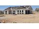 Under-construction single-Gathering home with the roof tiles ready to be installed at 1800 W Caramel Ct, Queen Creek, AZ 85144