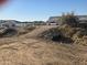 Flat vacant land ready to build with view of desert community and surrounding houses at 1800 W Caramel Ct, Queen Creek, AZ 85144