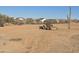 Flat vacant land ready to build with construction equipment in desert community at 1800 W Caramel Ct, Queen Creek, AZ 85144