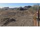 Flat vacant land ready to build with view of desert community and surrounding mountains at 1800 W Caramel Ct, Queen Creek, AZ 85144