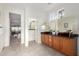 Bright bathroom featuring double sinks, a large mirror, and natural light at 19793 N Tapestry Ct, Surprise, AZ 85374