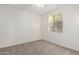 Bedroom with carpet, a window, and neutral walls, bathed in natural light at 19793 N Tapestry Ct, Surprise, AZ 85374