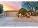 Charming home exterior with well-maintained landscaping, desert accents, and a spacious three-car garage at 19793 N Tapestry Ct, Surprise, AZ 85374