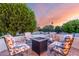 Inviting outdoor fire pit area surrounded by comfortable seating, perfect for relaxing evenings and gatherings at 19793 N Tapestry Ct, Surprise, AZ 85374