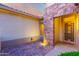 Inviting front porch with stone accents and security door adding character and charm to the entrance at 19793 N Tapestry Ct, Surprise, AZ 85374