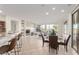 Open-concept living room featuring a fireplace, large windows, and elegant decor, creating a welcoming atmosphere at 19793 N Tapestry Ct, Surprise, AZ 85374