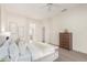 Spacious main bedroom featuring carpet, neutral colors, a queen sized bed and ample natural light at 19793 N Tapestry Ct, Surprise, AZ 85374