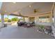 Relaxing outdoor patio with comfortable seating and ceiling fans for a cool and breezy atmosphere at 19793 N Tapestry Ct, Surprise, AZ 85374